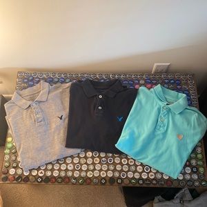 3 Pack American Eagle Polo Shirts -Mens size M- Black, Gray, Neon, slightly used